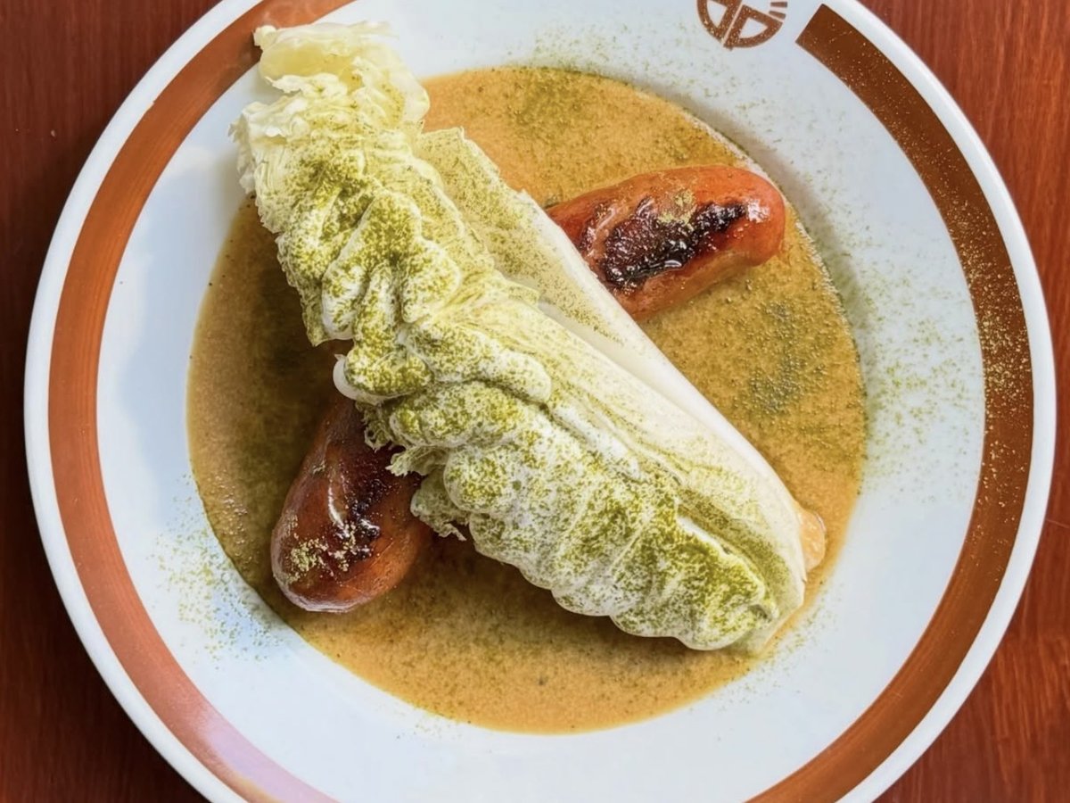 Serbian sausage with Dorion sauce and a wedge of romaine lettuce